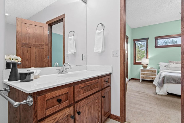 bathroom with vanity and a textured ceiling