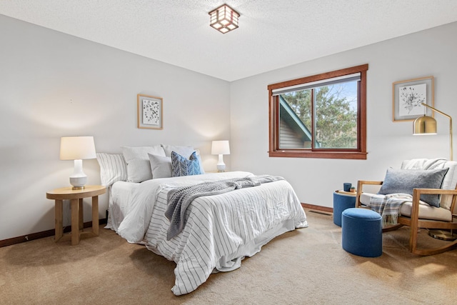 carpeted bedroom with a textured ceiling