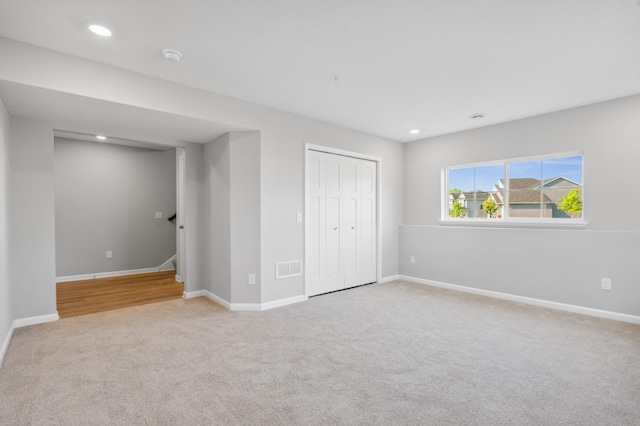 unfurnished bedroom featuring a closet, visible vents, and baseboards