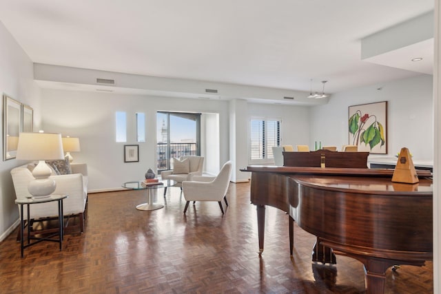 miscellaneous room with dark parquet floors