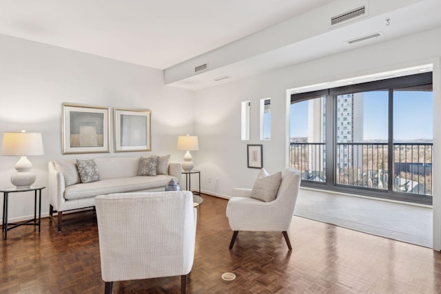 living room featuring dark parquet floors