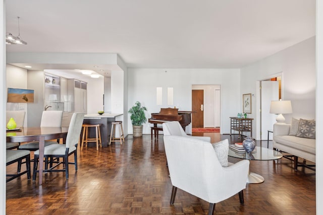 living room featuring dark parquet floors