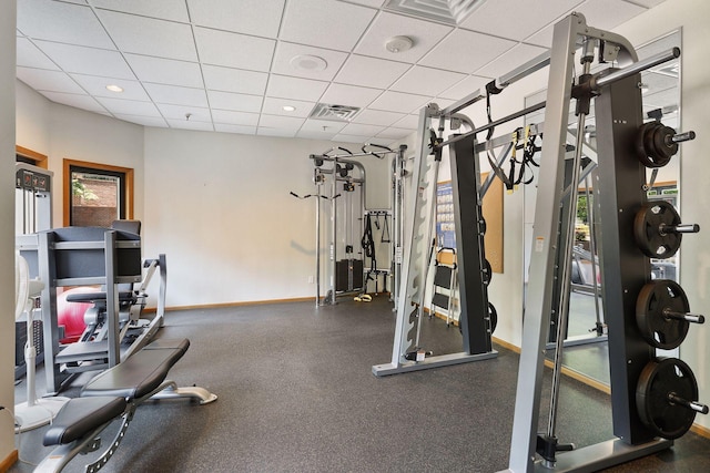 workout area featuring a paneled ceiling