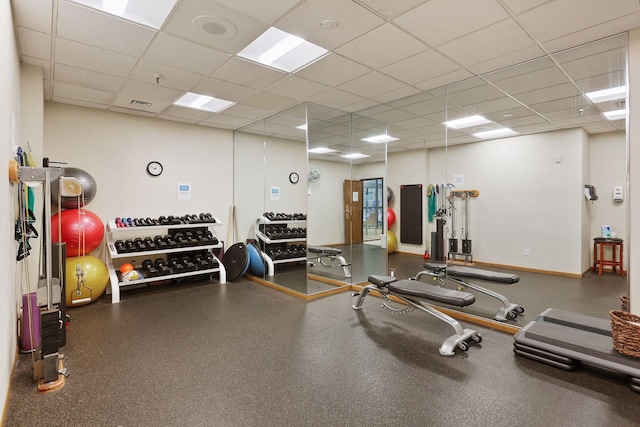 exercise room featuring a drop ceiling