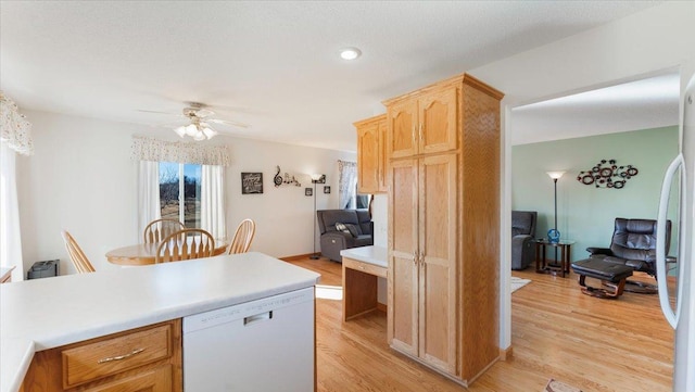 kitchen with light countertops, a ceiling fan, freestanding refrigerator, light wood-type flooring, and dishwasher