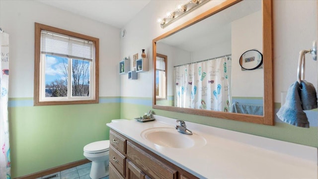 full bath with curtained shower, vanity, toilet, and tile patterned floors