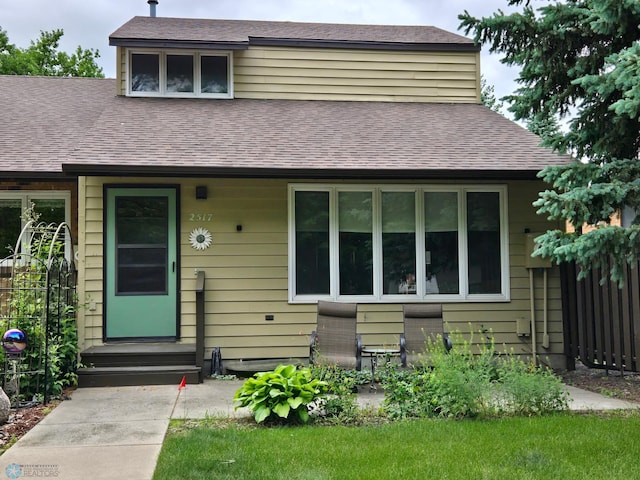 2517 Country Club Dr S Unit 10, Fargo, ND 58103 - view of front of house with a shingled roof