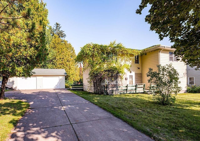 obstructed view of property with a front lawn, an outbuilding, and a detached garage