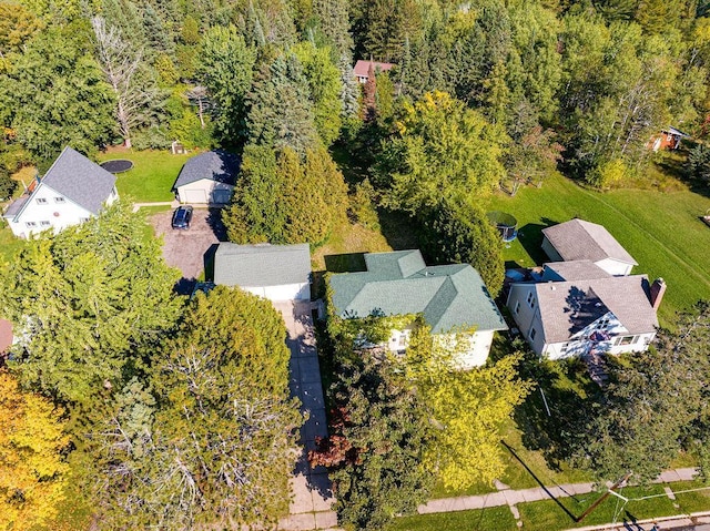 bird's eye view featuring a wooded view