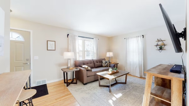 living room featuring light wood-type flooring