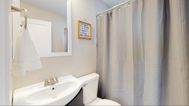 bathroom with vanity and toilet