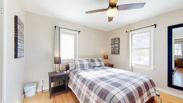 bedroom featuring ceiling fan and light wood-type flooring