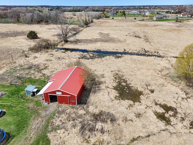 birds eye view of property featuring a rural view