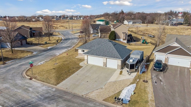 birds eye view of property with a residential view