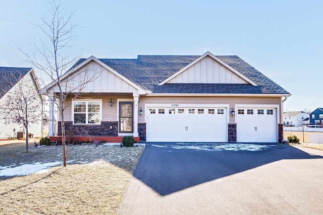 craftsman-style home with a garage and central AC