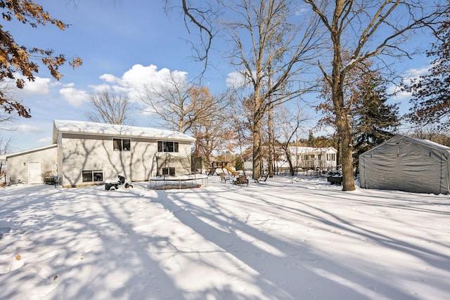 view of yard layered in snow