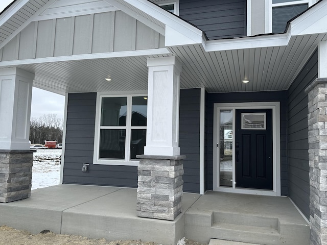 doorway to property with board and batten siding