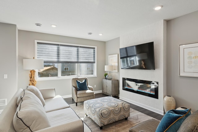 living room with dark hardwood / wood-style flooring