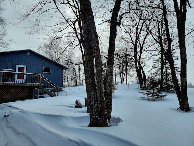 view of yard layered in snow