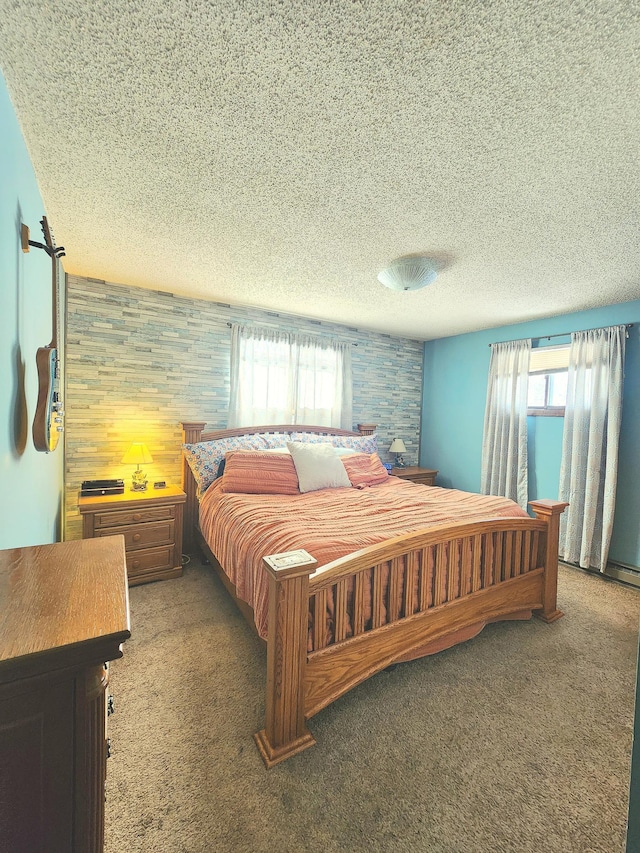 carpeted bedroom with multiple windows, wooden walls, and a textured ceiling