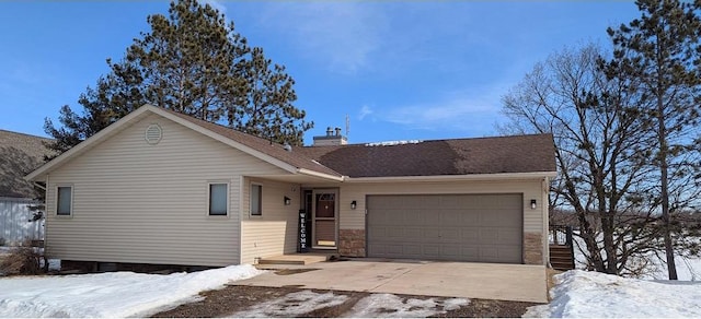 single story home with an attached garage and a chimney