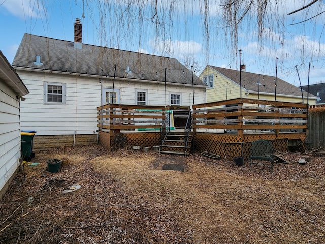 back of property featuring a deck