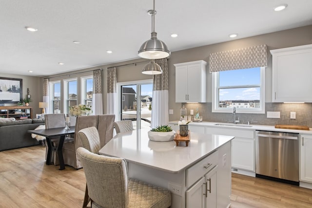 kitchen featuring white cabinetry, sink, and stainless steel dishwasher