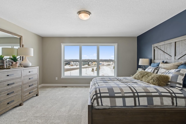 carpeted bedroom with a textured ceiling