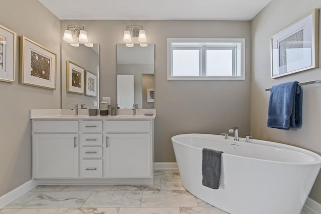 bathroom featuring a washtub and vanity