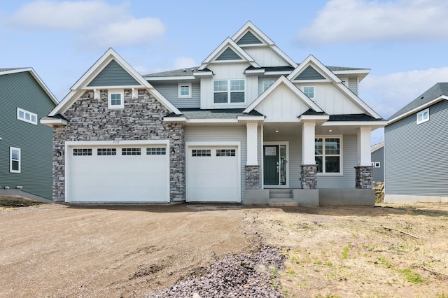 craftsman-style house featuring a garage and covered porch