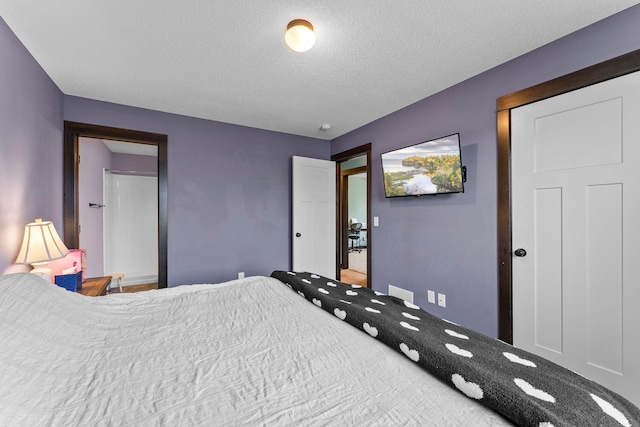 bedroom featuring a textured ceiling