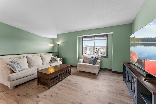 living room featuring light wood-style flooring and baseboards