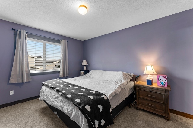 carpeted bedroom with a textured ceiling and baseboards