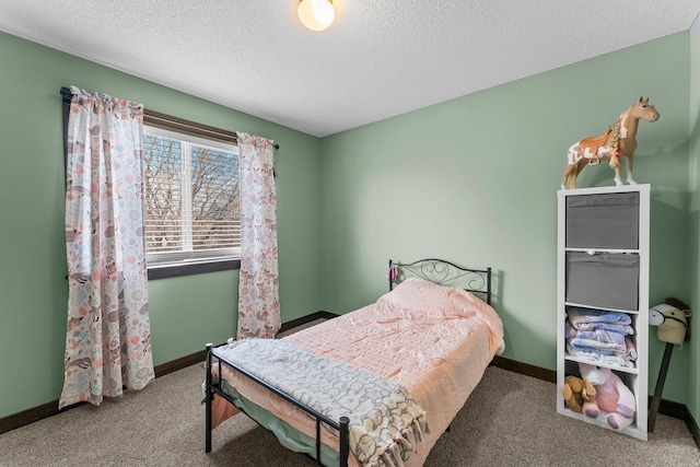 carpeted bedroom with baseboards and a textured ceiling