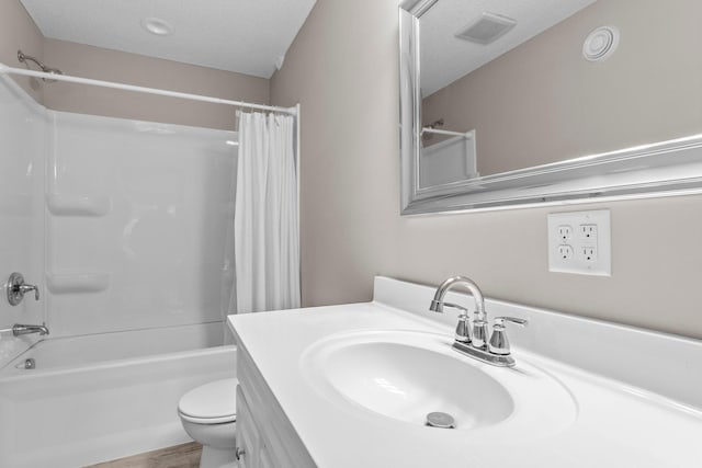 full bath featuring shower / bath combination with curtain, toilet, visible vents, and a textured ceiling