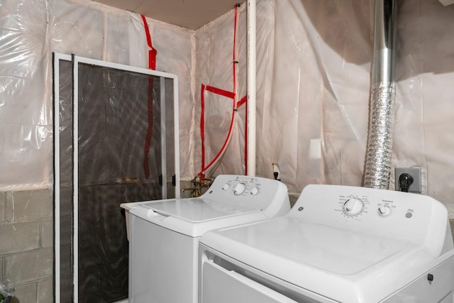 laundry room with independent washer and dryer and laundry area