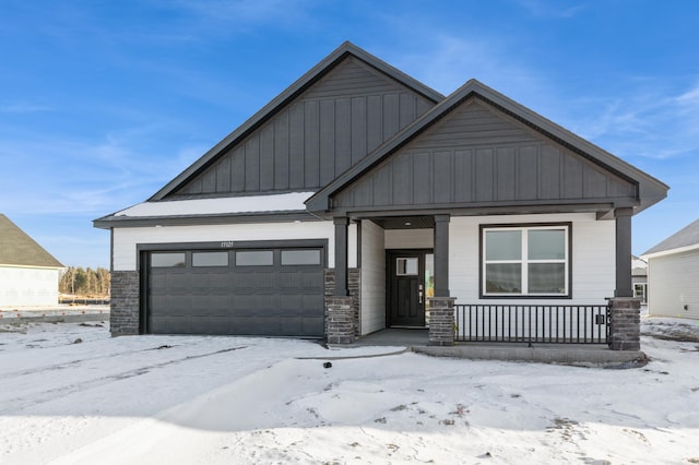 view of front of house with a garage and a porch