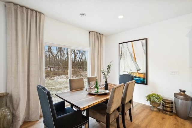 dining area with light hardwood / wood-style flooring