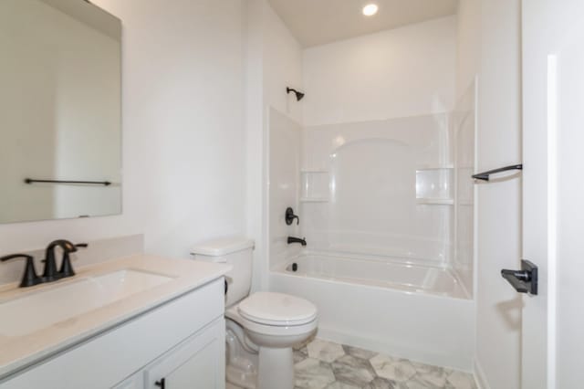 full bathroom featuring vanity, washtub / shower combination, and toilet