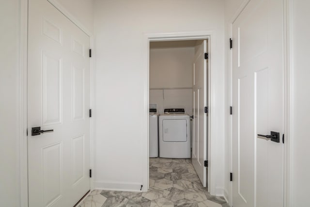 hall with washer and clothes dryer