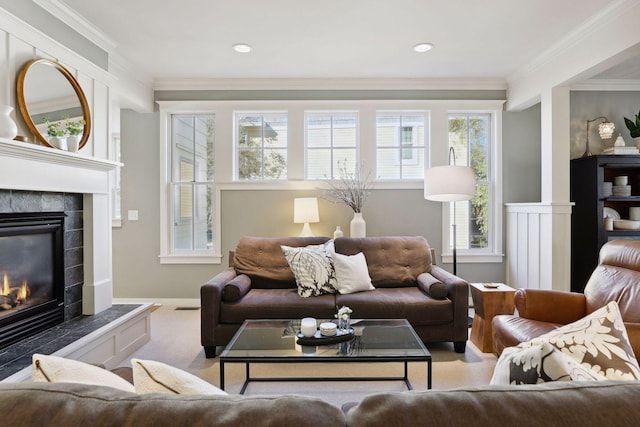 carpeted living room featuring a fireplace and crown molding