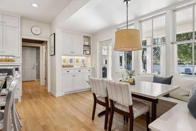 dining room featuring recessed lighting and light wood finished floors