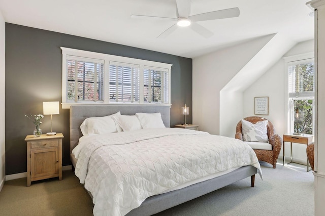 bedroom featuring light carpet, baseboards, and ceiling fan