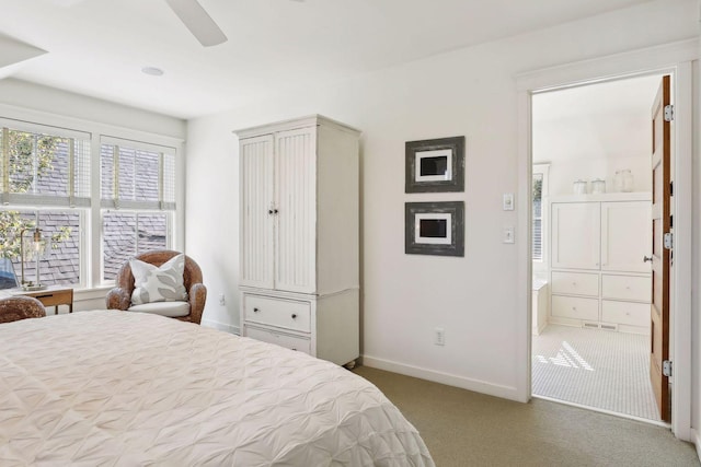 bedroom featuring visible vents, connected bathroom, baseboards, carpet flooring, and a ceiling fan