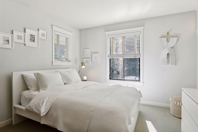 carpeted bedroom with baseboards