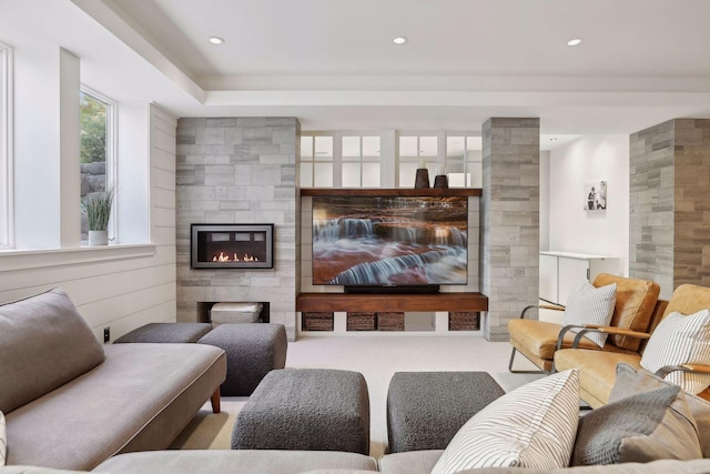 living area featuring recessed lighting, carpet flooring, and a tile fireplace