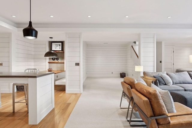 living room with recessed lighting and light wood-type flooring