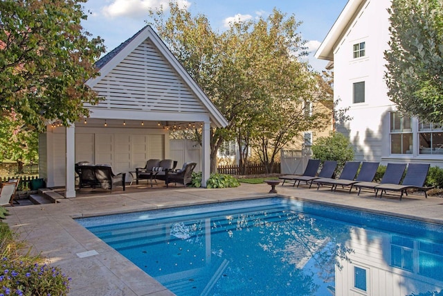 view of swimming pool featuring a gazebo, a patio, fence, and a fenced in pool