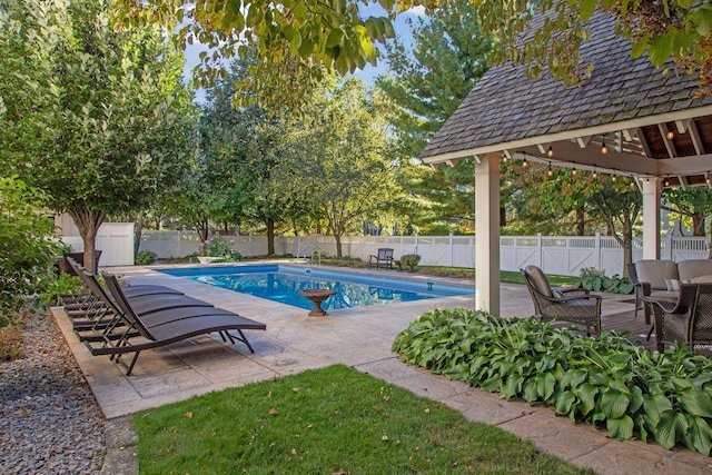 view of pool with a gazebo, a fenced in pool, a patio, and a fenced backyard