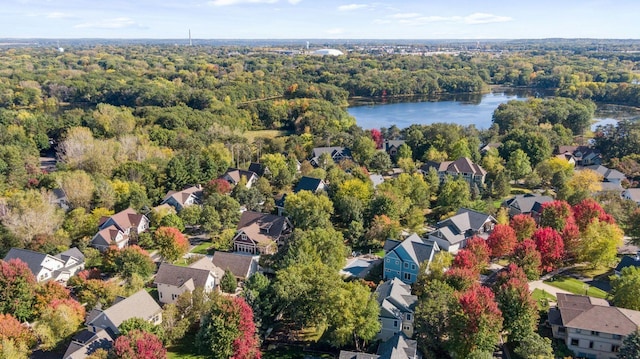 aerial view with a residential view, a water view, and a wooded view